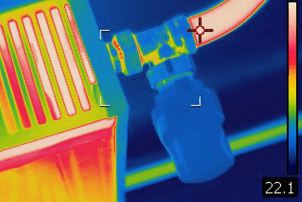 Thermal imaging camera detecting hidden water leak in Dubai villa wall - non-invasive leak detection technology